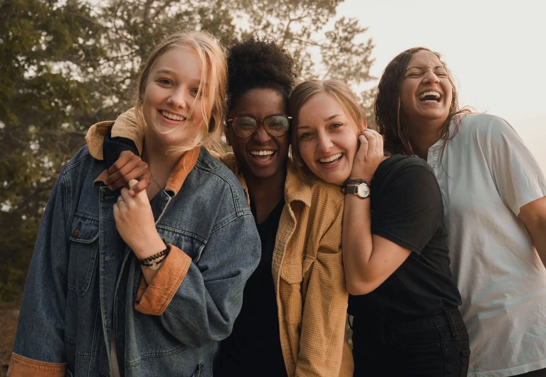 Girls laughing together outdoors, representing Brown Rice's advocacy community